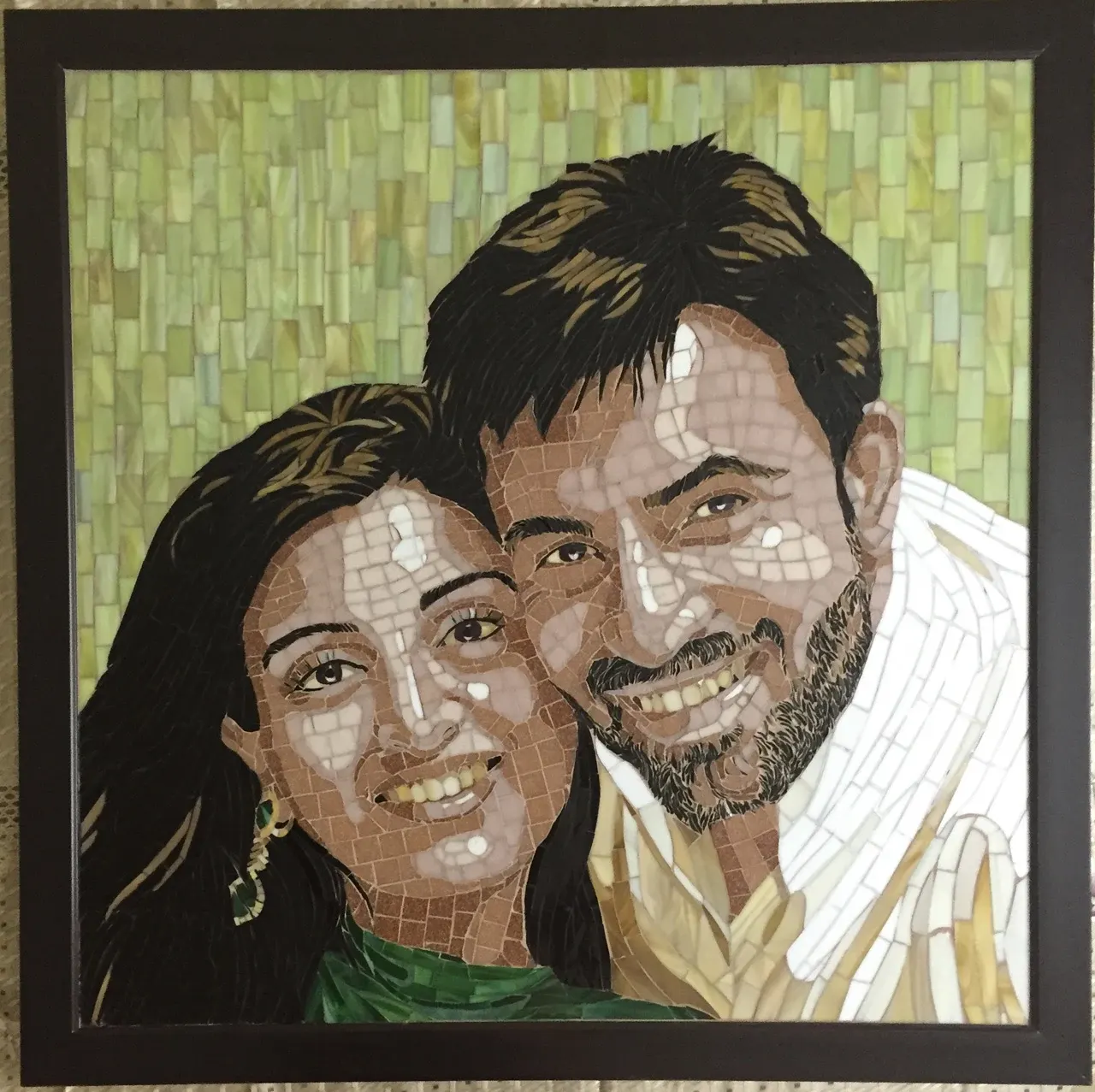 Mosaic portrait of a couple in hand-cut glass tiles and stained glass