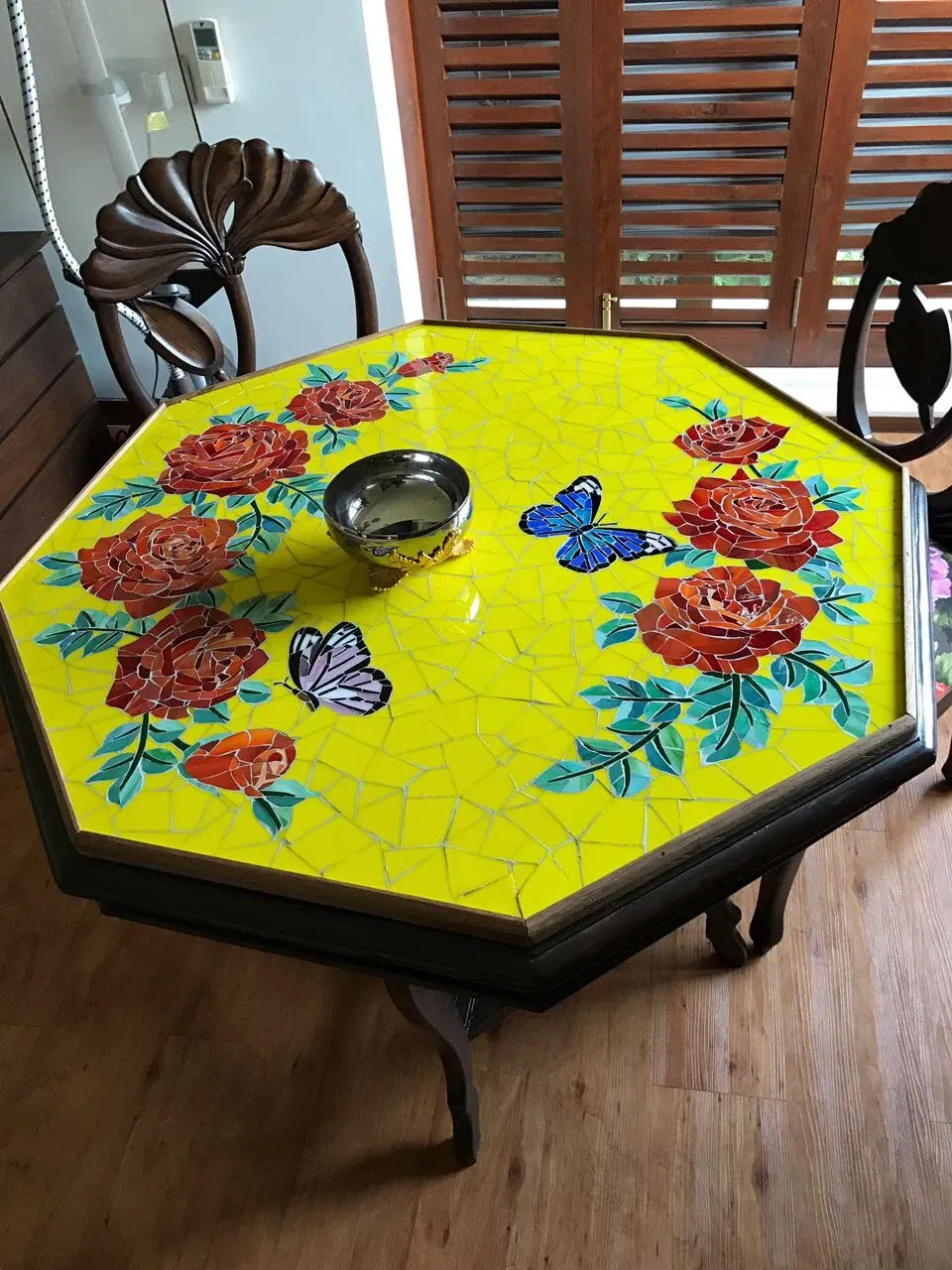 Octagonal mosaic table top with roses and butterflies